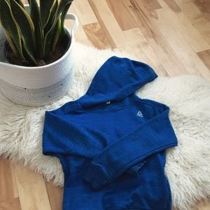 A dark blue rebook sweater